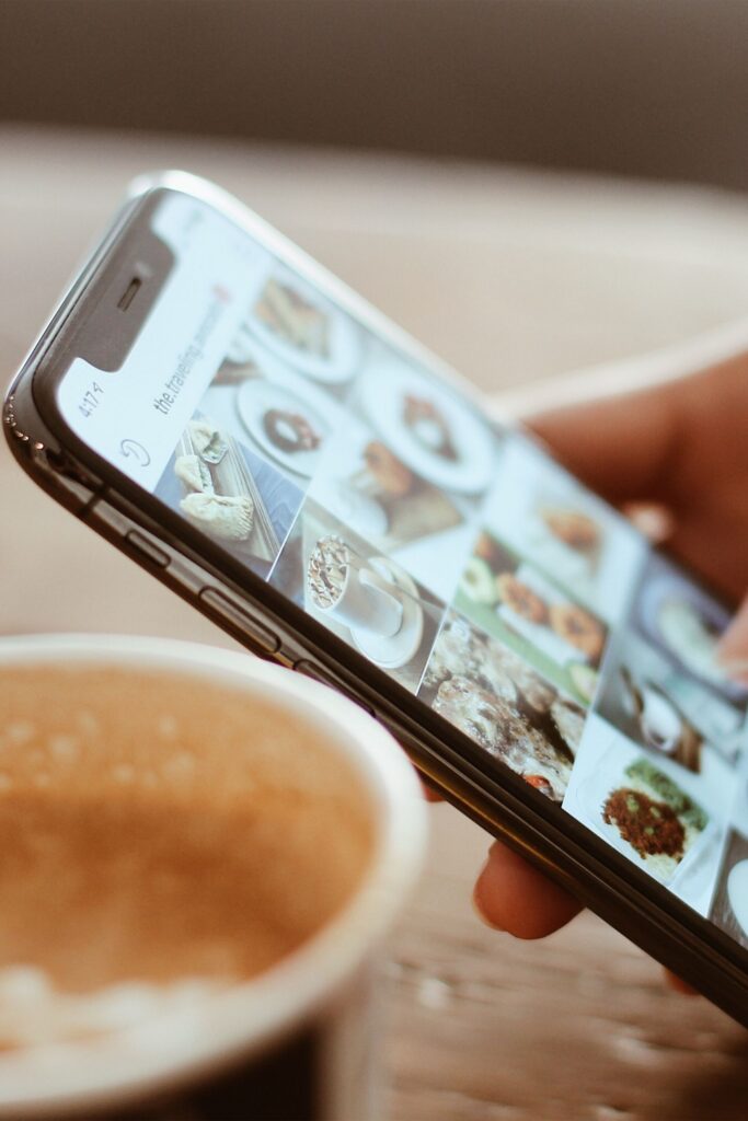 instagram feed on a smart phone and a coffee for social media content