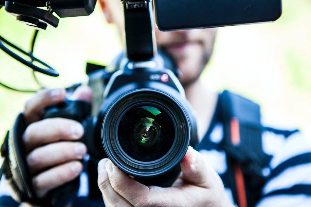 person with camera equipment creating a vlog 